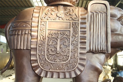 高强度铜雕佛像贴金技法及其在石雕中的应用